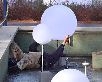 Globe being eased into place